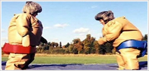 two people in sumo suits